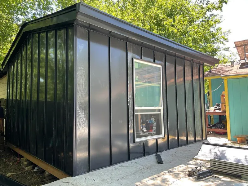 Black standing seam metal wall panels for Metal Roof Installation in West Lealman