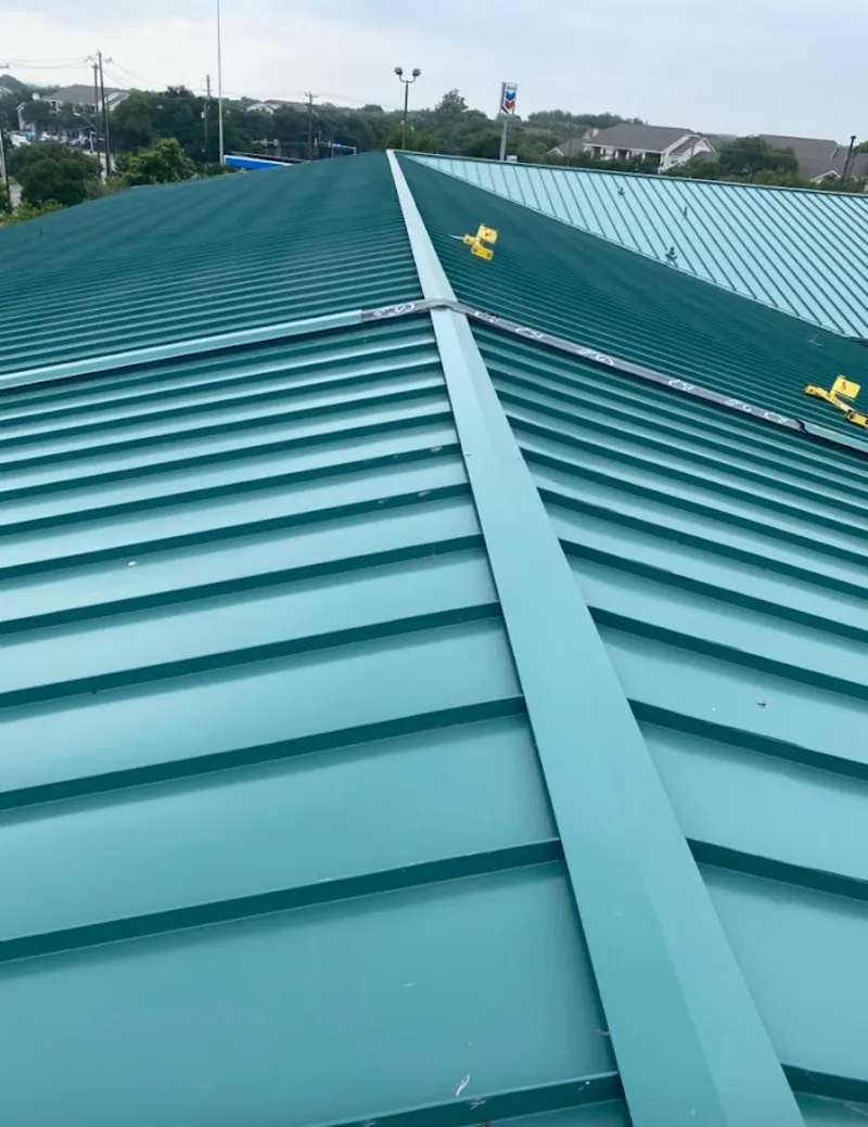 Green commercial metal roof ridge and valley for Metal Roof Repair in West Lealman